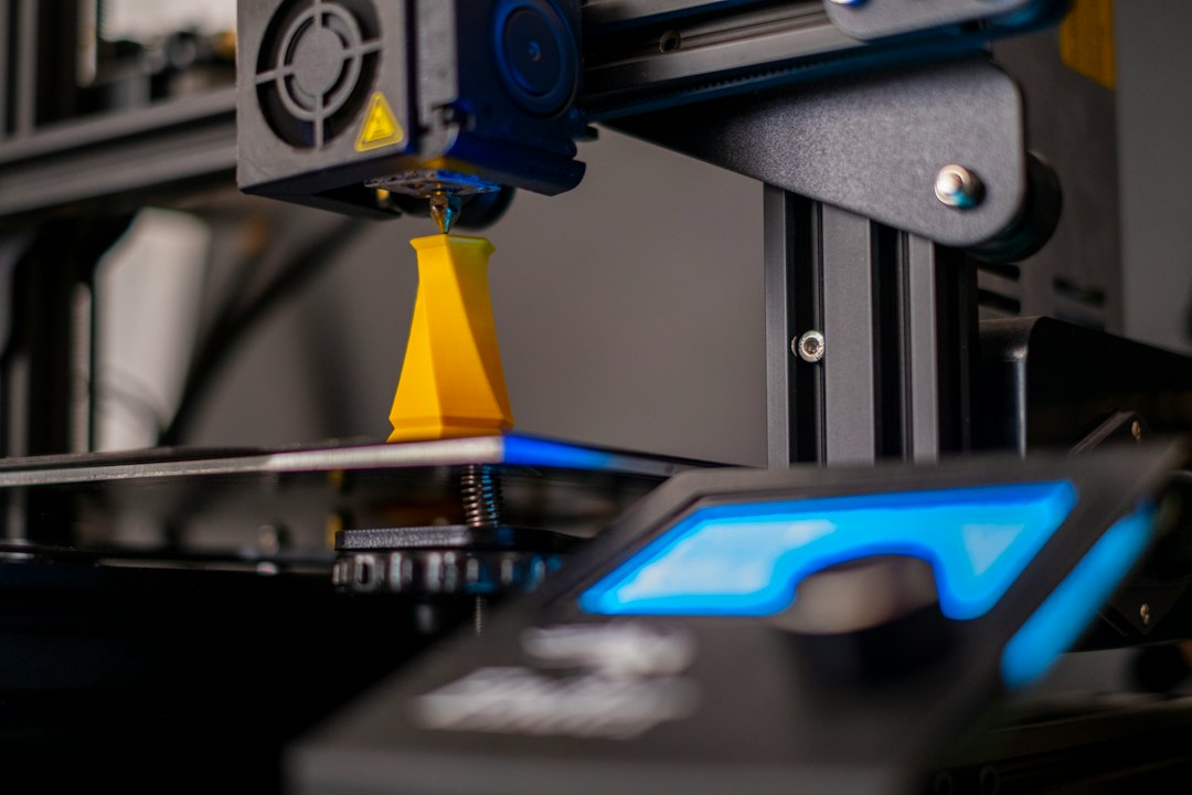 Close-up of a 3D printer producing a part